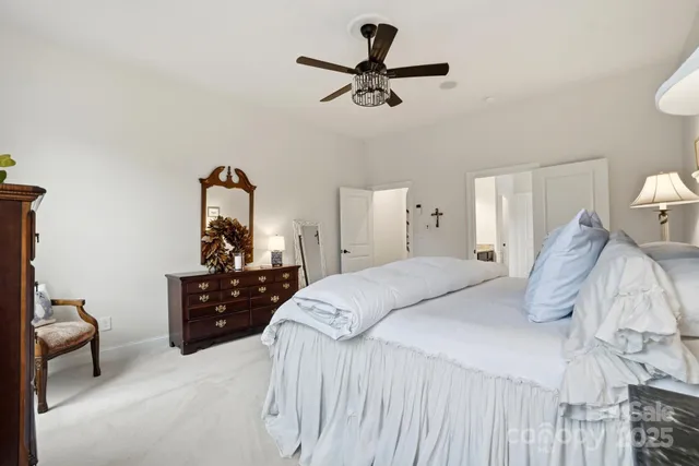 a bedroom with a bed and lamp