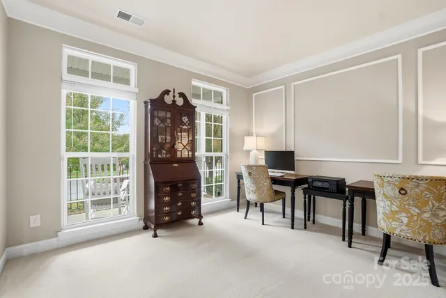 a bedroom with furniture and a window