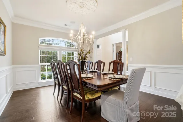 a view of swimming pool with a garden and seating area