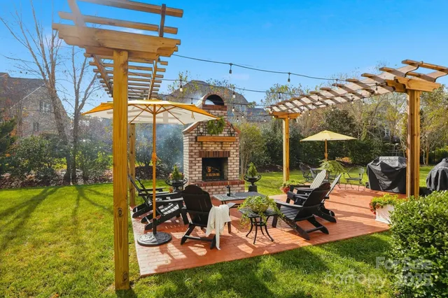 a view of a house with backyard porch and sitting area