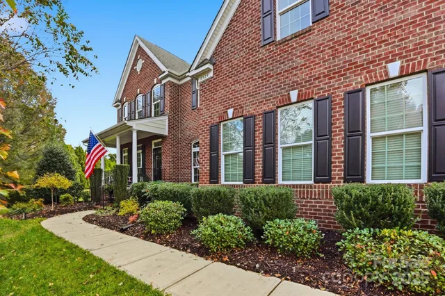 a view of an entryway with wooden floor and windows