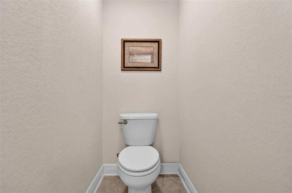 2429 Twin Lake View Road Winter Haven, FL 33881 - Photo 27 of 37 a white toilet sitting next to a white wall
