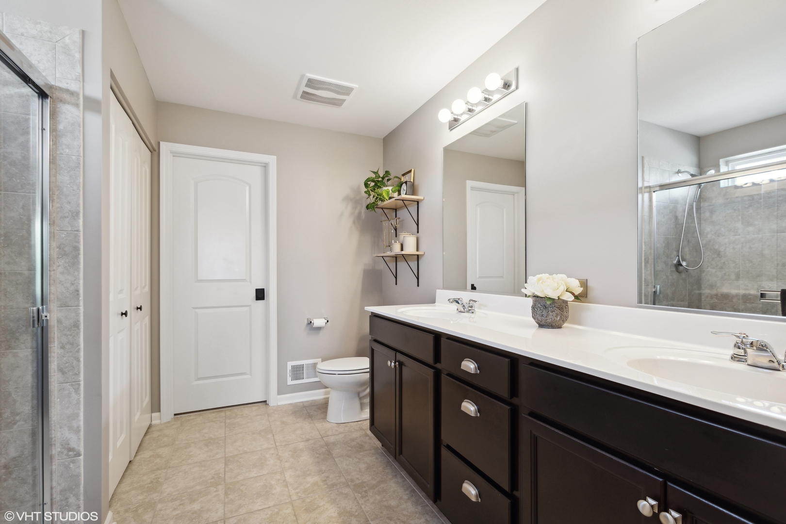 3302 Batley Street Elgin, IL 60124 - Photo 16 of 28 a spacious bathroom with a double vanity sink and a mirror