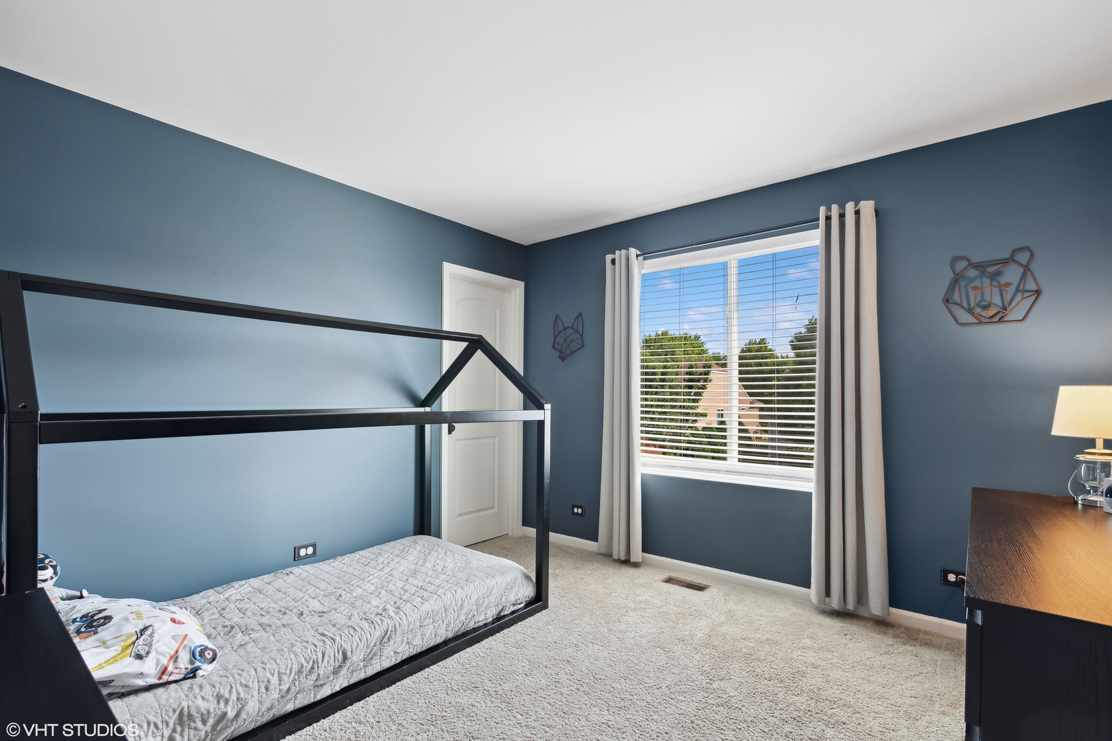 3302 Batley Street Elgin, IL 60124 - Photo 20 of 28 a bedroom with a bed and a tv on table