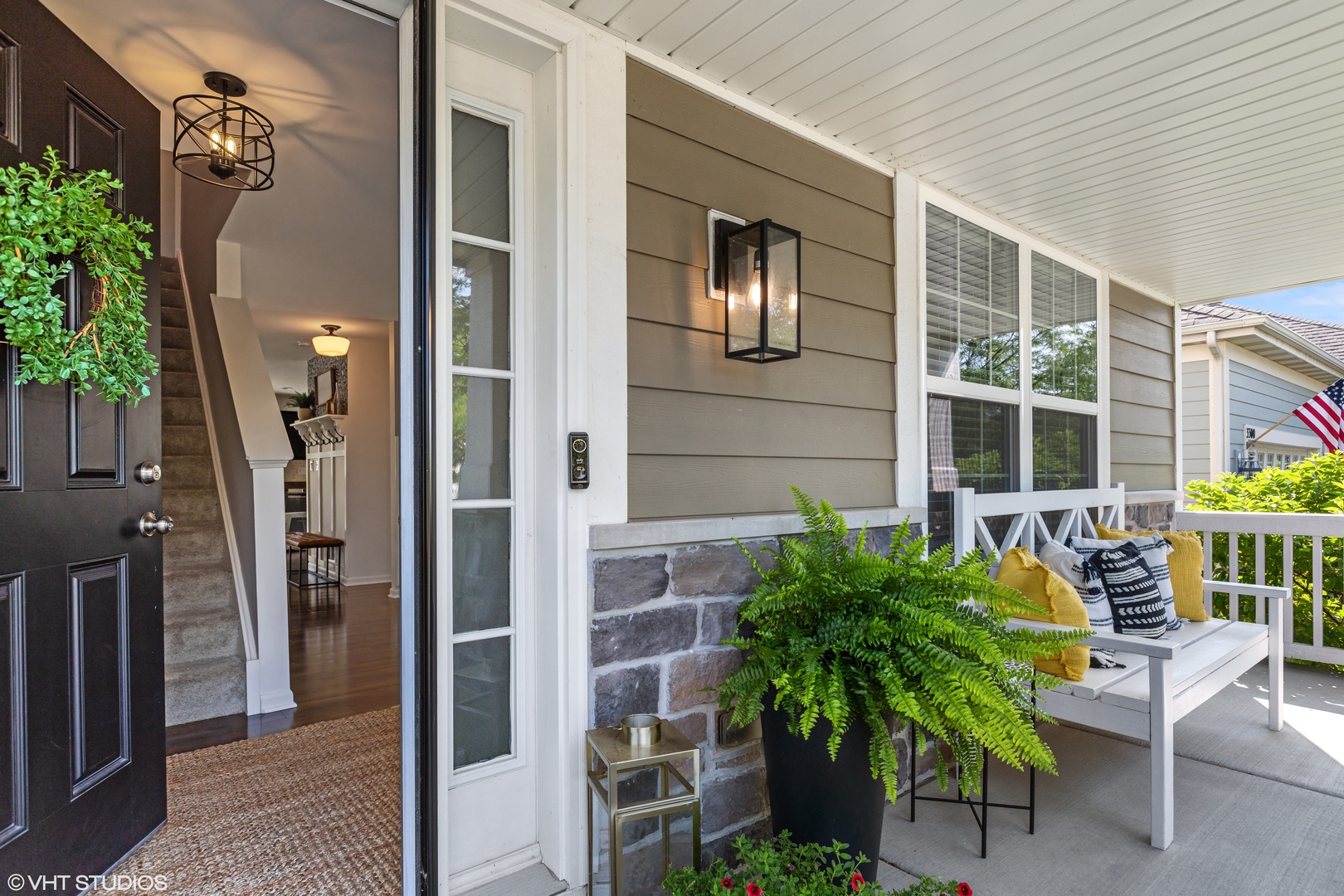 3302 Batley Street Elgin, IL 60124 - Photo 2 of 28 a porch with seating space and potted plants