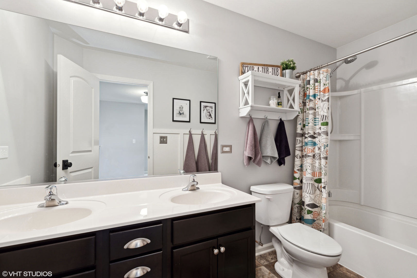 3302 Batley Street Elgin, IL 60124 - Photo 21 of 28 a bathroom with a sink a toilet and shower