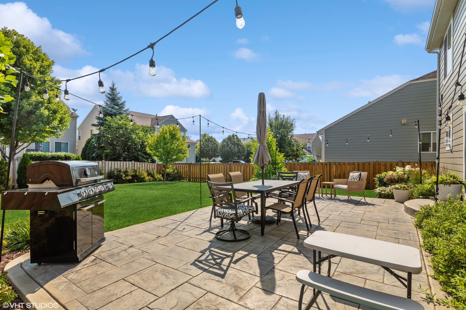 3302 Batley Street Elgin, IL 60124 - Photo 24 of 28 a view of a patio with a table and chairs