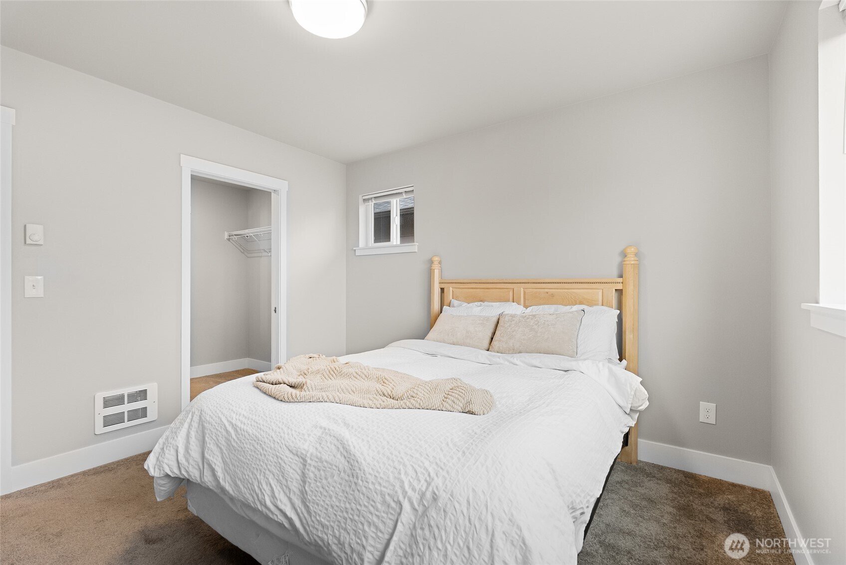 1884 Front Street Lynden, WA 98264 - Photo 20 of 35 a bedroom with a bed and a painting on the wall