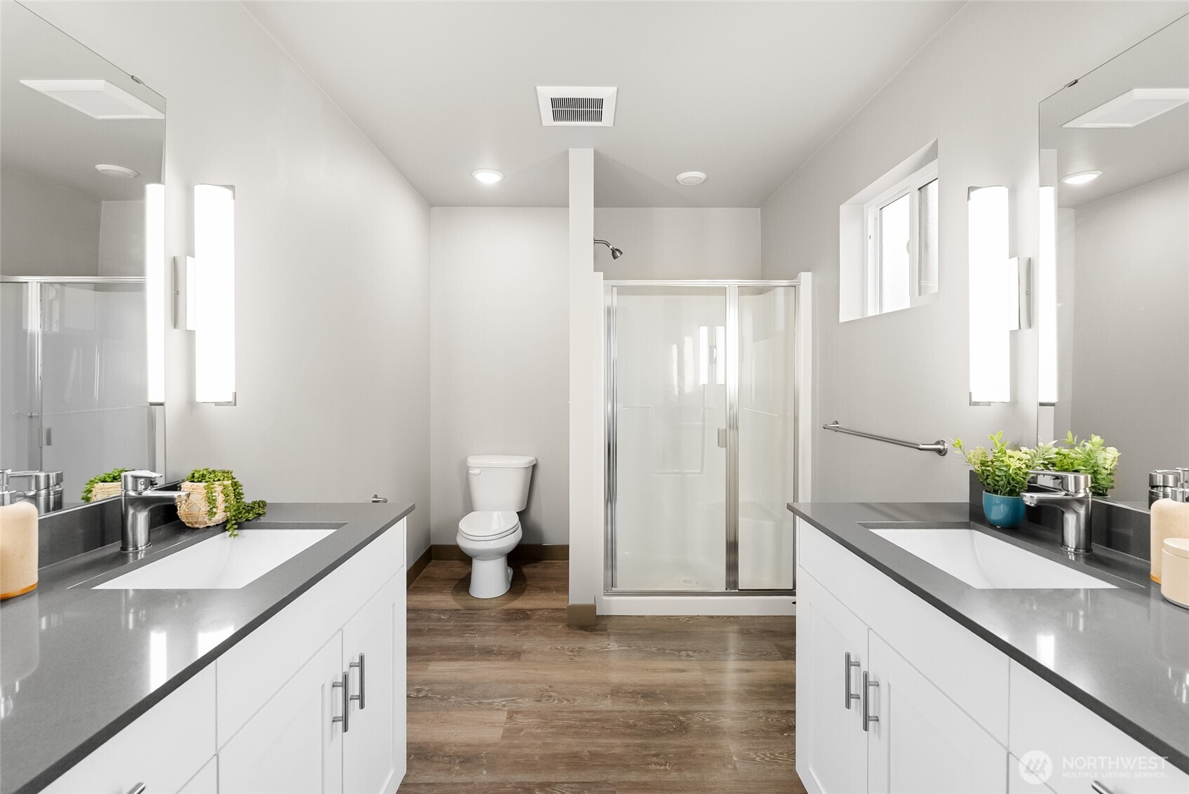 1884 Front Street Lynden, WA 98264 - Photo 21 of 35 a bathroom with a granite countertop sink a toilet and shower