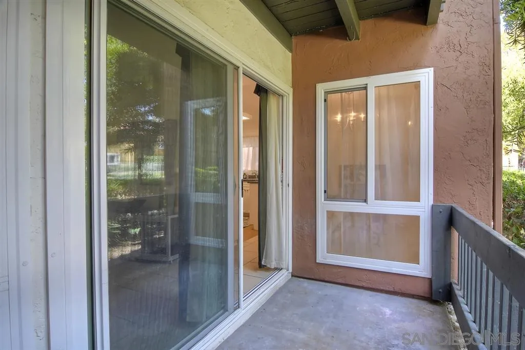 17119 West Bernardo Drive, Unit 108 San Diego, CA 92127 - Photo 16 of 18 a view of a hallway with a glass door and shower
