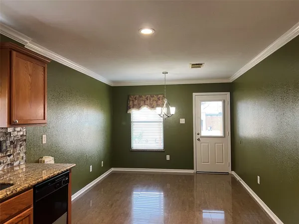 a view of room with a ceiling fan and window