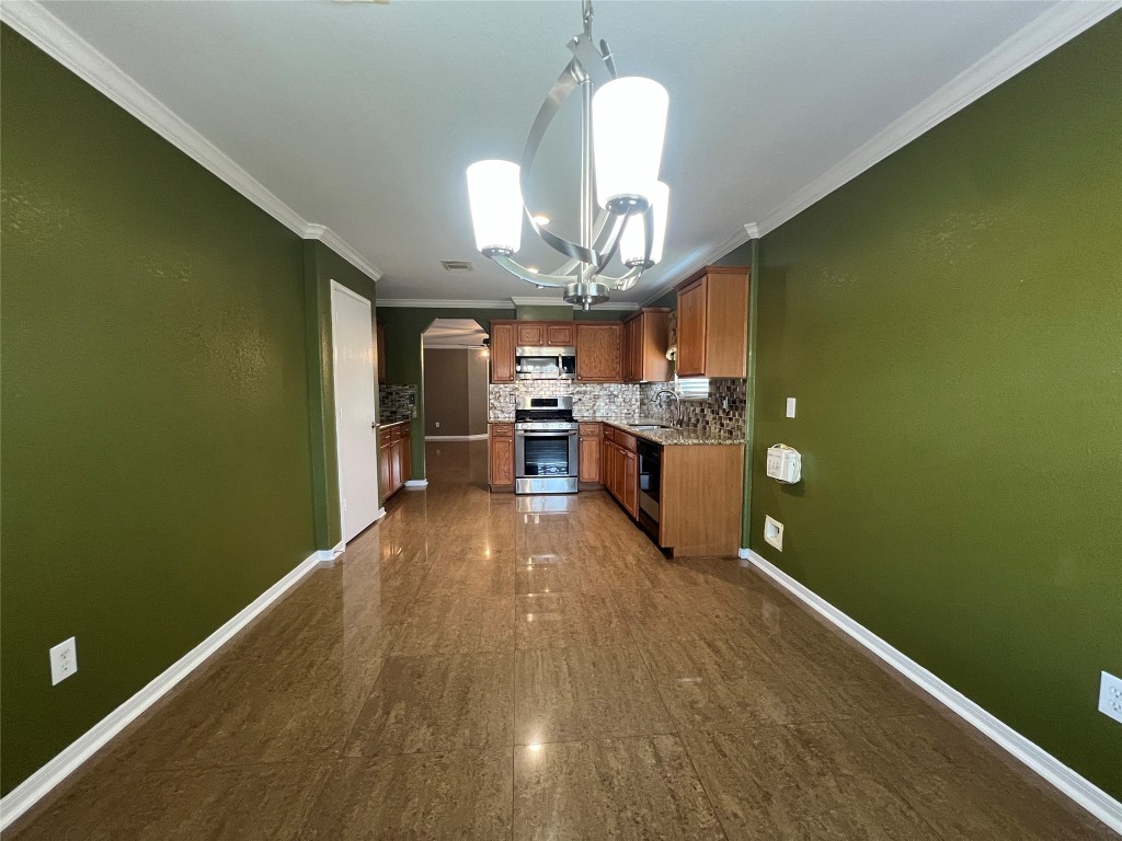 915 Wild Cotton Road Rosenberg, TX 77471 - Photo 17 of 38 a view of a room with kitchen and dining room view