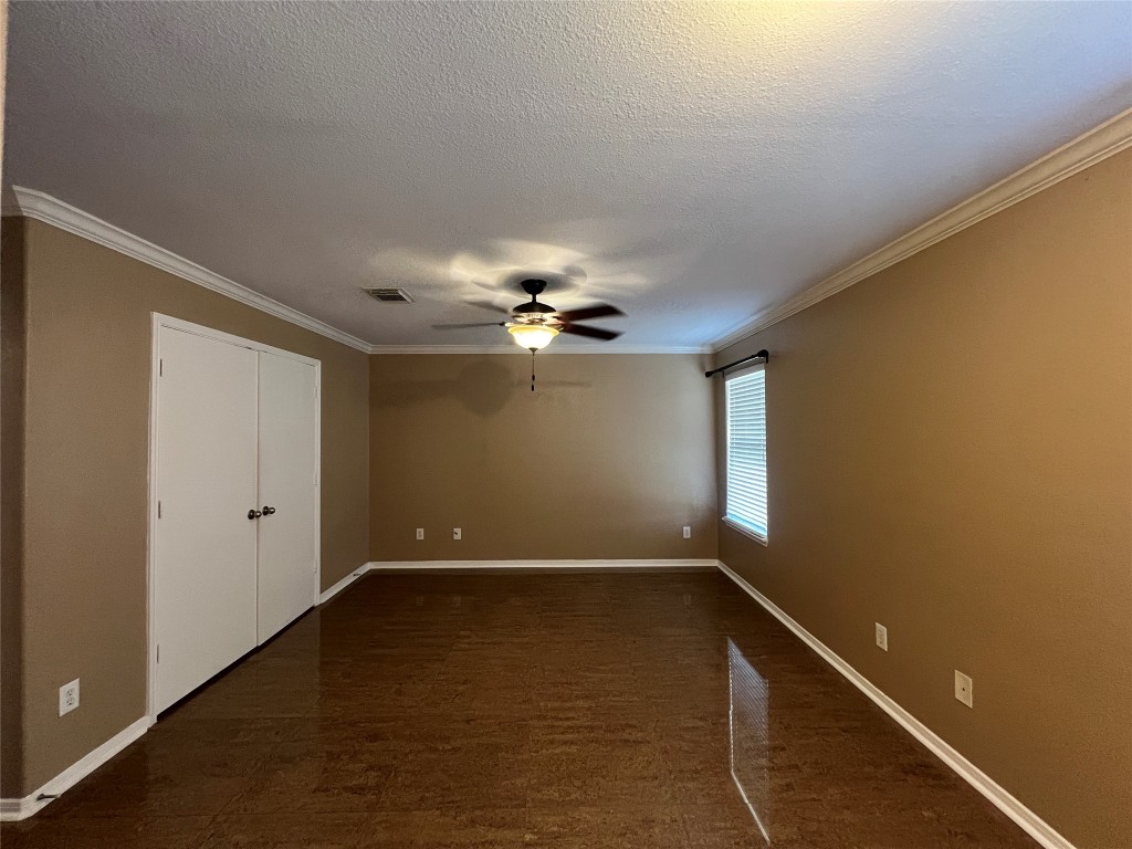 915 Wild Cotton Road Rosenberg, TX 77471 - Photo 19 of 38 a view of room with a ceiling fan and window