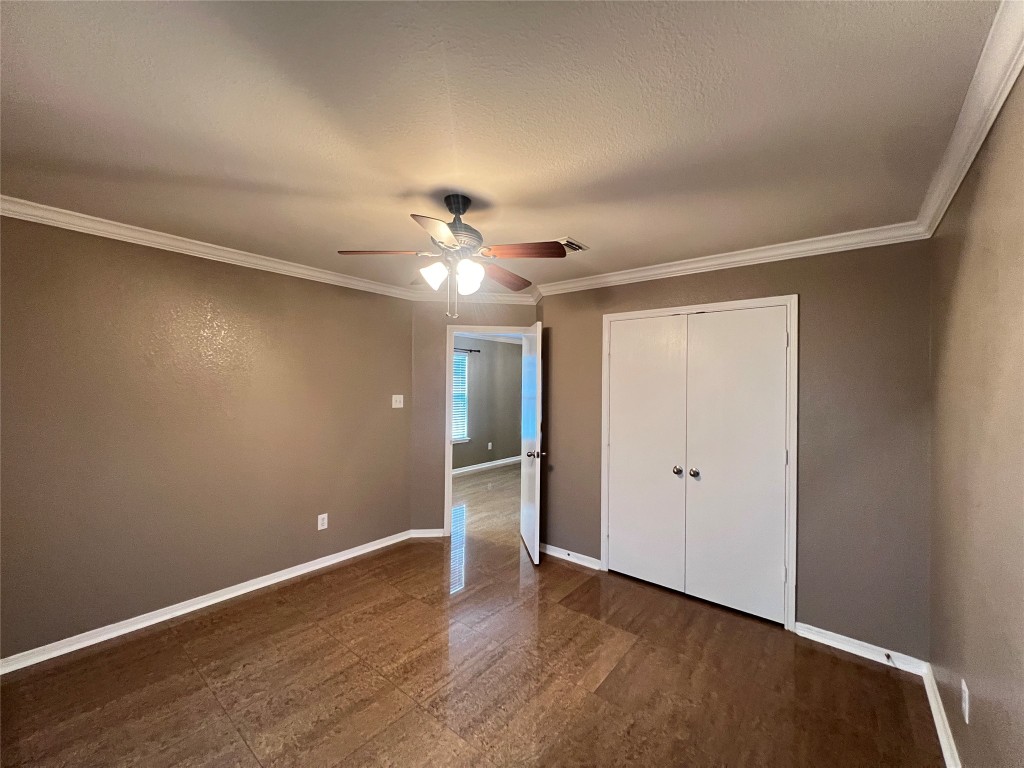 915 Wild Cotton Road Rosenberg, TX 77471 - Photo 23 of 38 a view of an empty room with wooden floor
