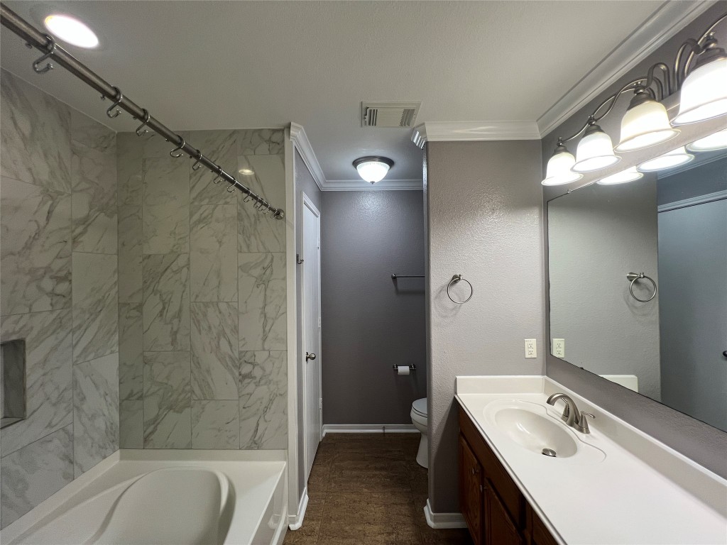 915 Wild Cotton Road Rosenberg, TX 77471 - Photo 25 of 38 a bathroom with a tub sink vanity granite and shower