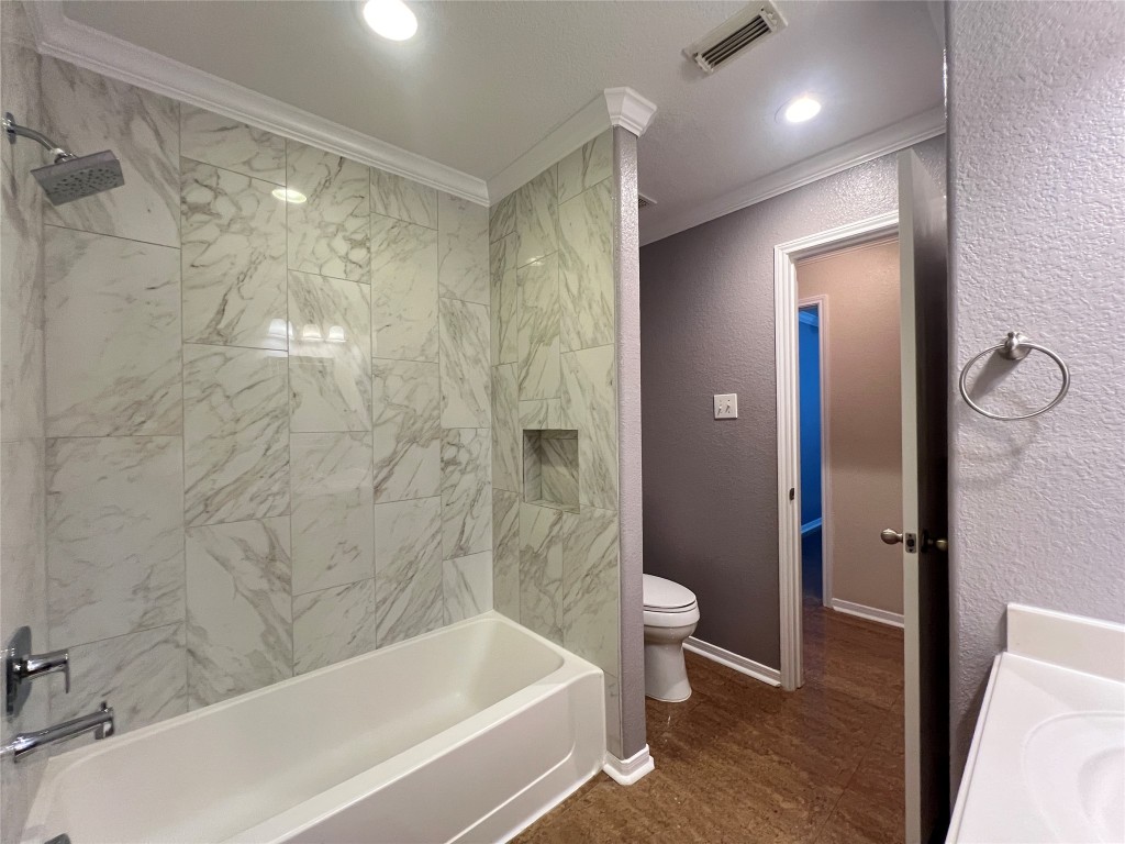 915 Wild Cotton Road Rosenberg, TX 77471 - Photo 26 of 38 a bathroom with a bathtub and a shower