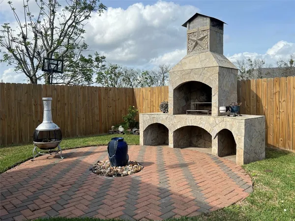 a patio with table and chairs