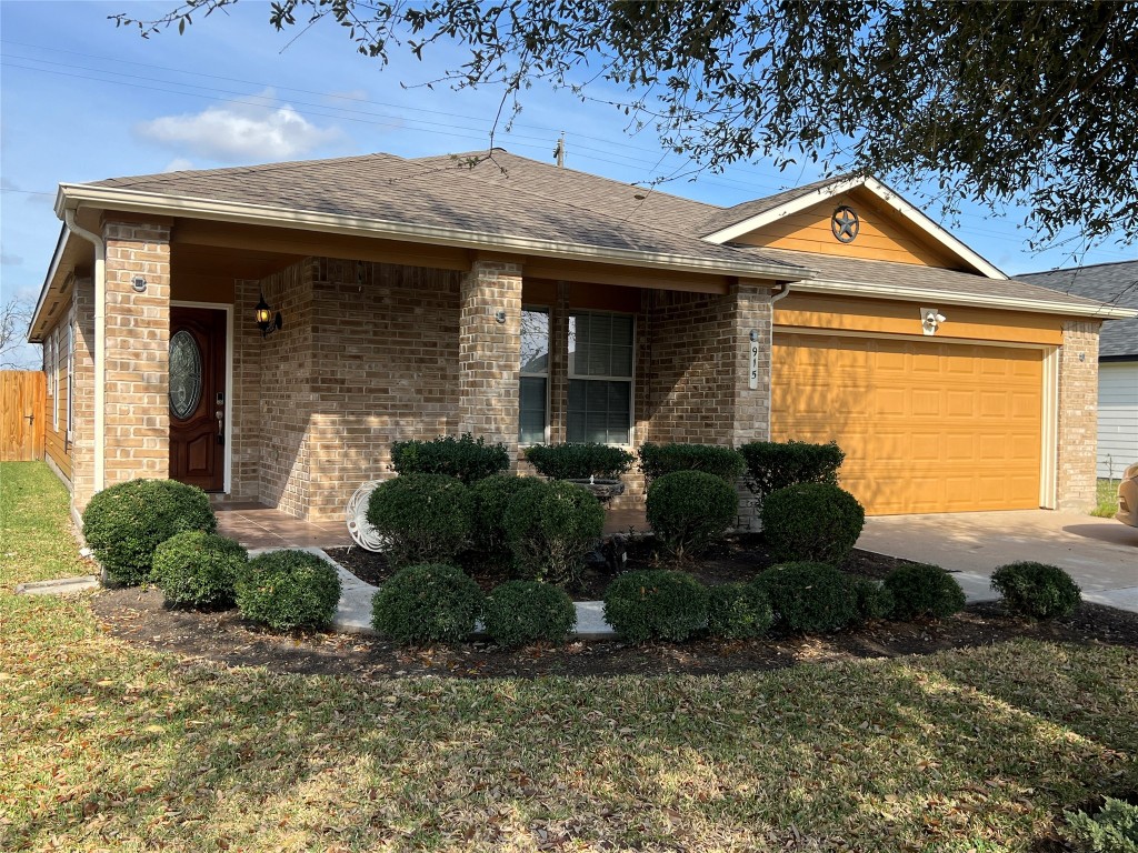 915 Wild Cotton Road Rosenberg, TX 77471 - Photo 38 of 38 a front view of a house with garden