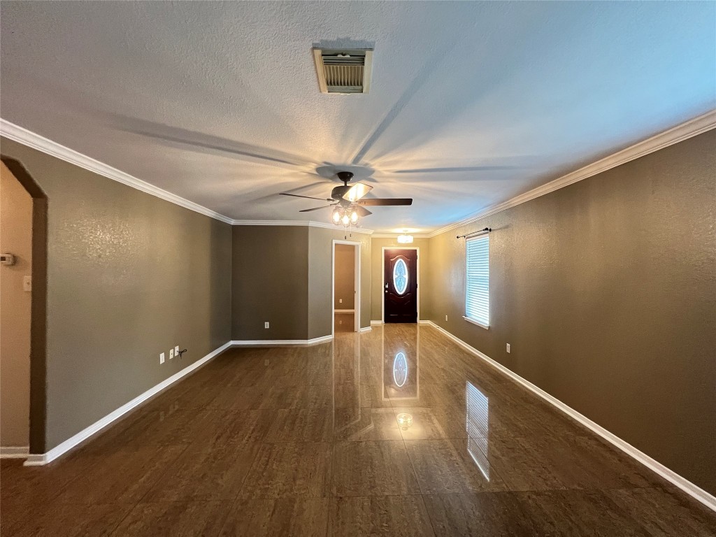 915 Wild Cotton Road Rosenberg, TX 77471 - Photo 5 of 38 wooden floor in an empty room with a window
