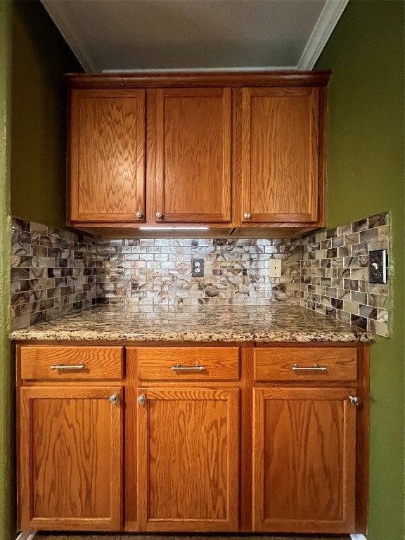 915 Wild Cotton Road Rosenberg, TX 77471 - Photo 10 of 38 a kitchen with granite countertop wooden cabinets and a sink