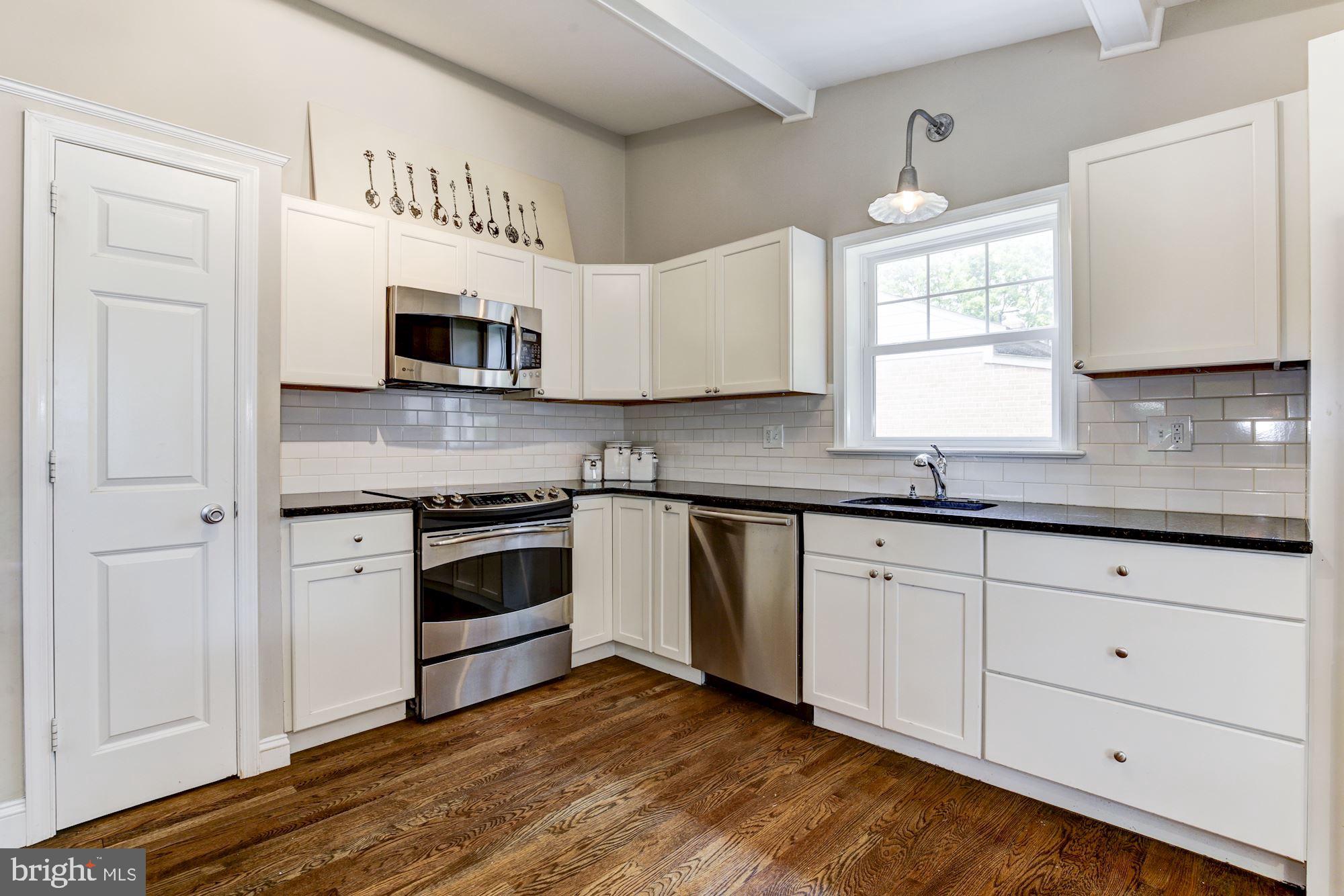 9907 Harrogate Road Bethesda, MD 20817 - Photo 6 of 17 Abundant white cabinetry, stainless appliances