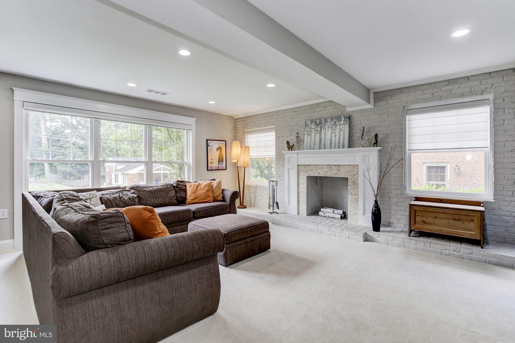 9907 Harrogate Road Bethesda, MD 20817 - Photo 8 of 17 Oversized family room with with brick surround FP