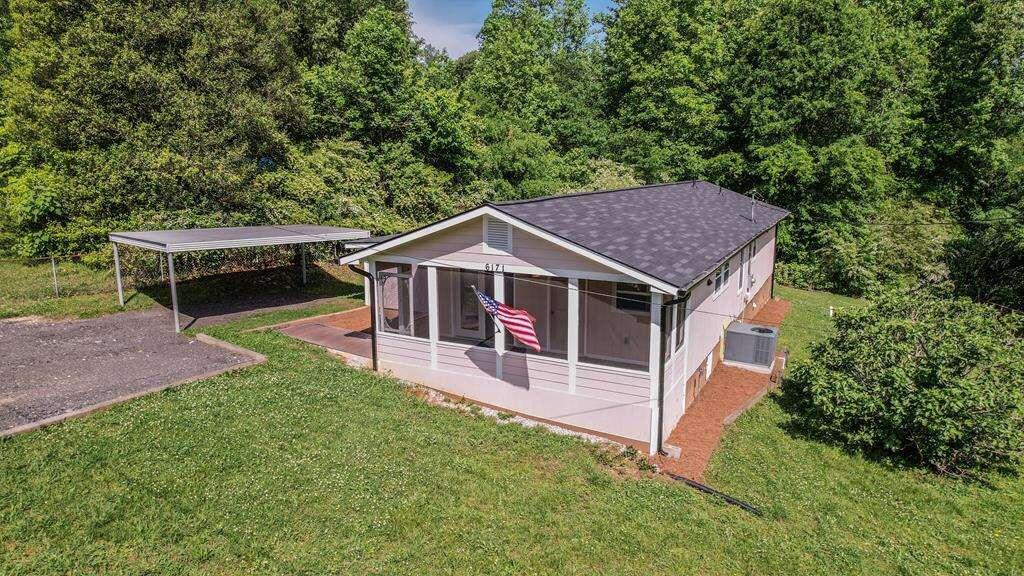 6171 Ridge Road Hiram, GA 30141 - Photo 1 of 1 a house with trees in the background