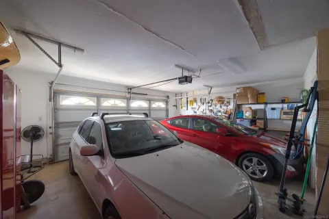 a view of parking garage with cars