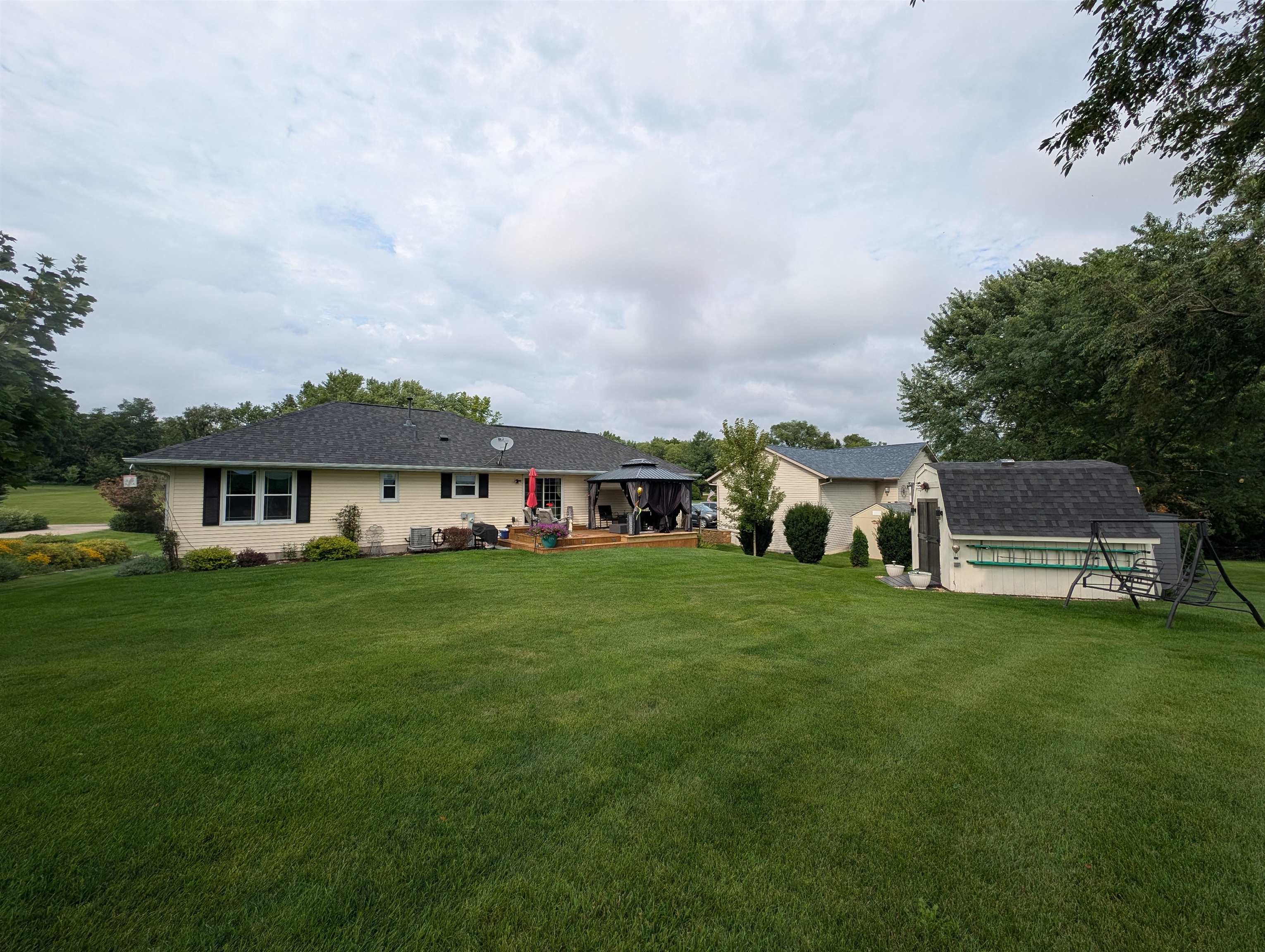 727 Westmore Road Davis, IL 61019 - Photo 24 of 32 a front view of a house with a garden