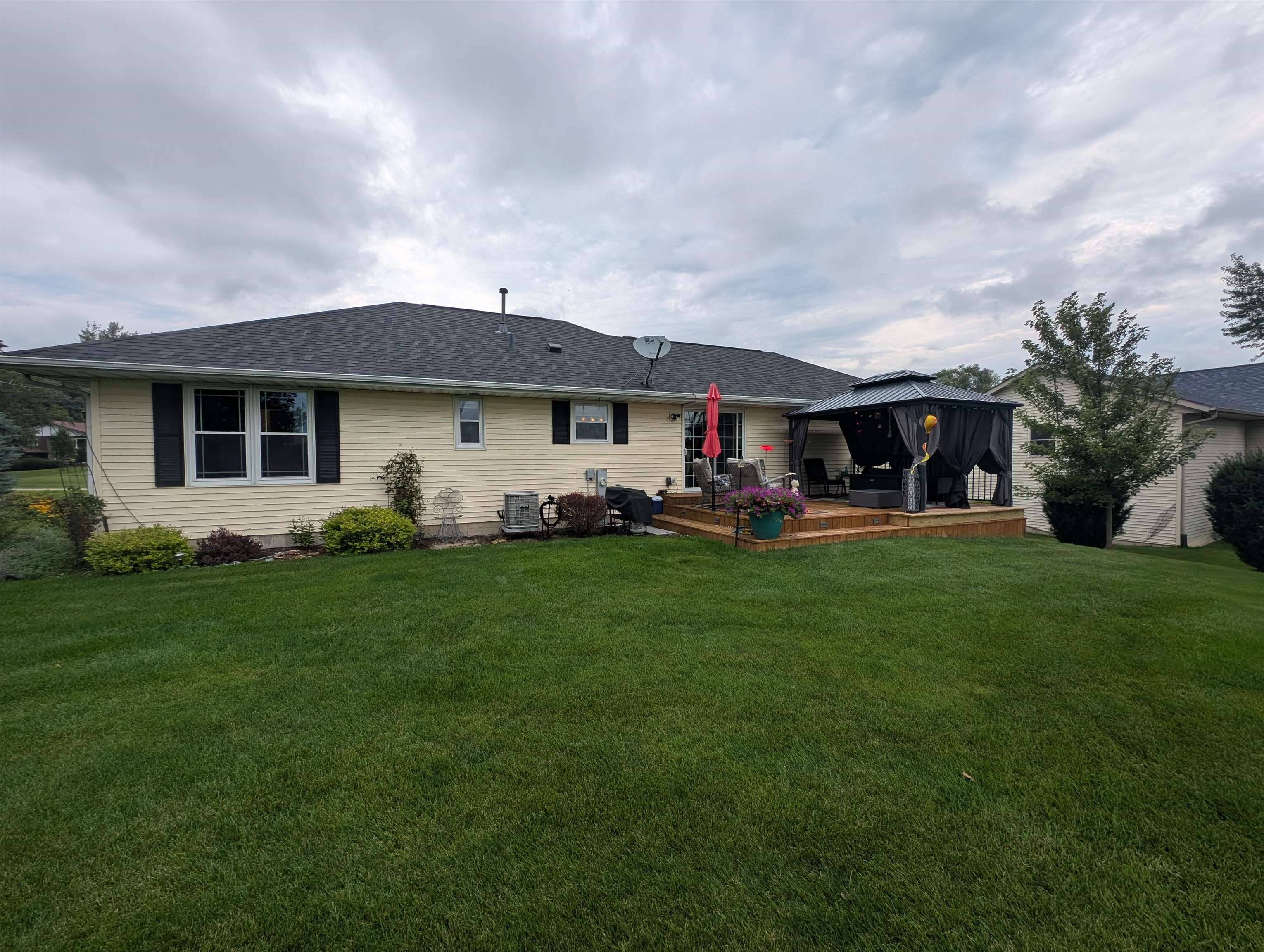 727 Westmore Road Davis, IL 61019 - Photo 25 of 32 a front view of a house with a garden and trees