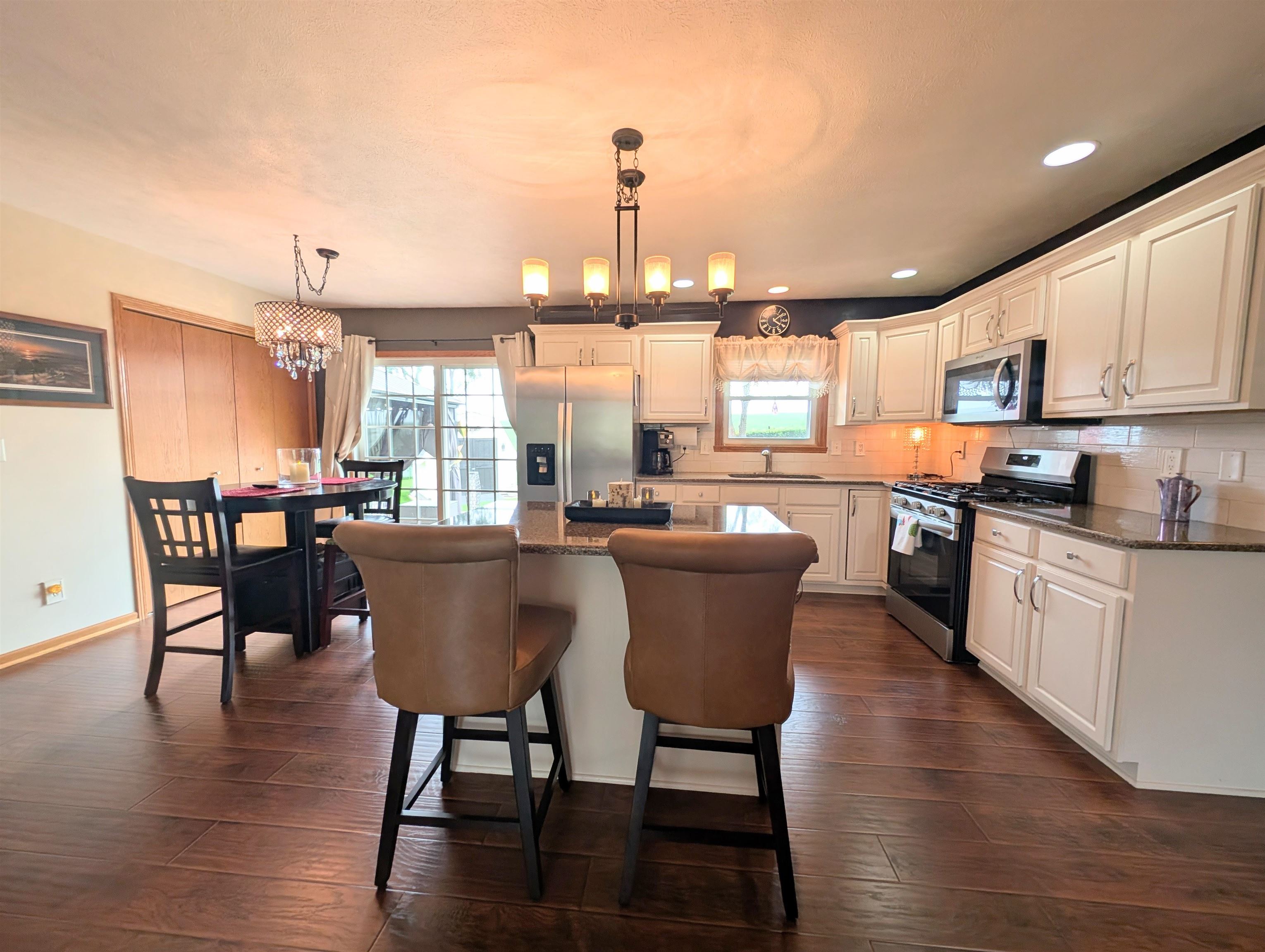 727 Westmore Road Davis, IL 61019 - Photo 5 of 32 a view of a dining room with furniture window and wooden floor
