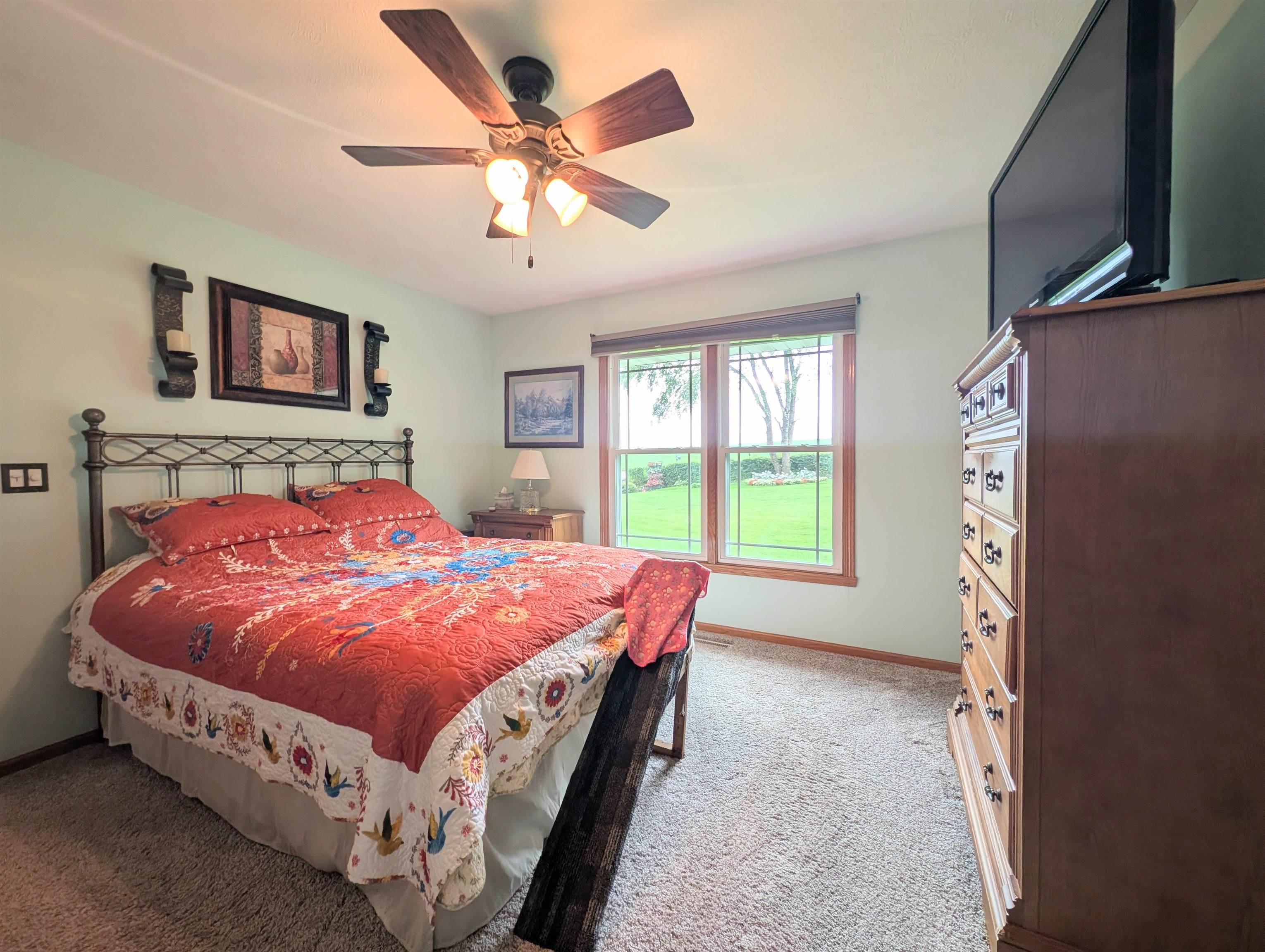 727 Westmore Road Davis, IL 61019 - Photo 8 of 32 a bedroom with a bed and a chandelier