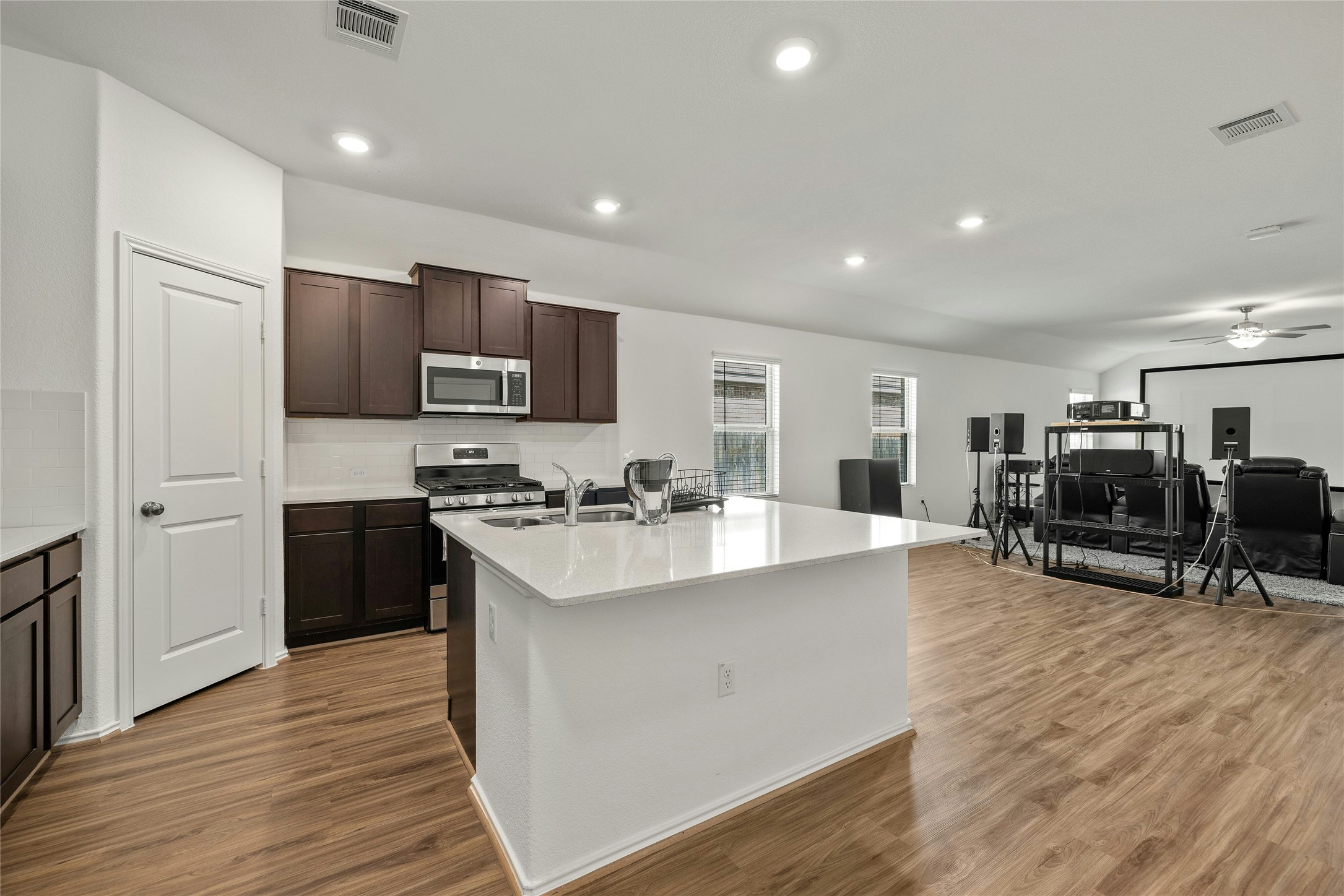 11813 Roscommon Trail Austin, TX 78754 - Photo 2 of 28 a view of kitchen with microwave stove top oven and refrigerator