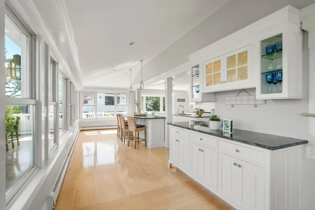 a kitchen with stainless steel appliances granite countertop a stove and cabinets