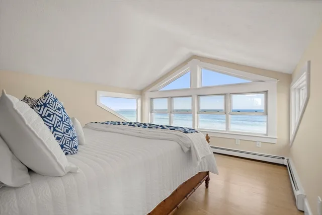 a bedroom with a bed and a night stand