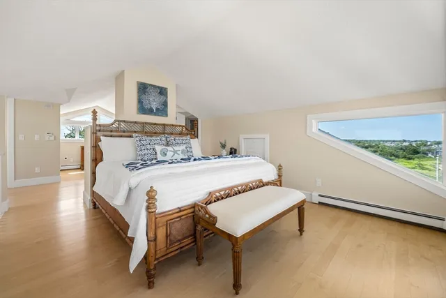 a bedroom with a bed and a table in it