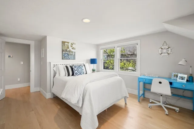 a bedroom with a bed and window