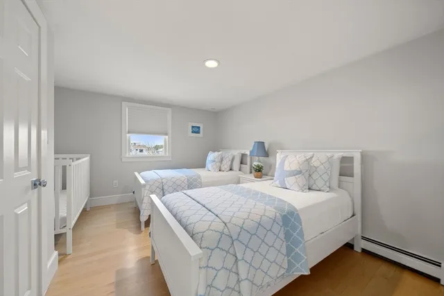 a living room with furniture cabinets and white walls