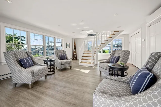 a workspace with wooden floor and a ceiling fan