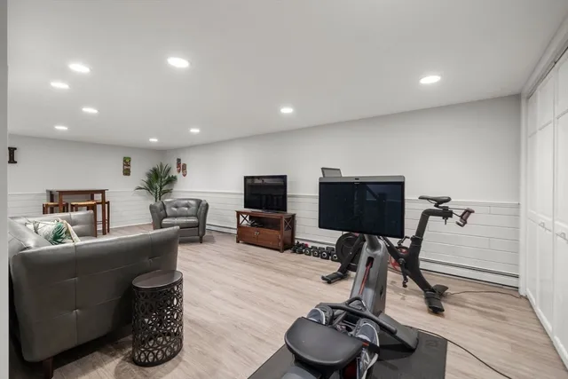 a kitchen with a refrigerator and a stove top oven