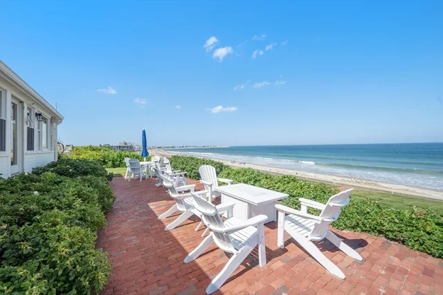 a view of a terrace with furniture and garden