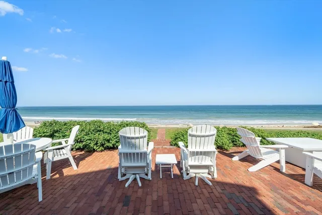 a front view of a house with a yard and staircase