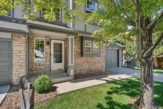 front view of a house with a yard