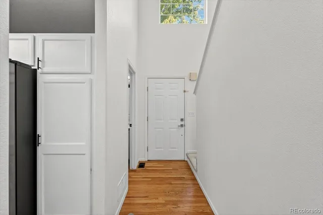 a view of hallway with wooden floor