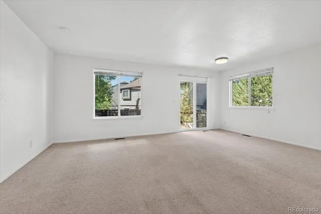 an empty room with windows