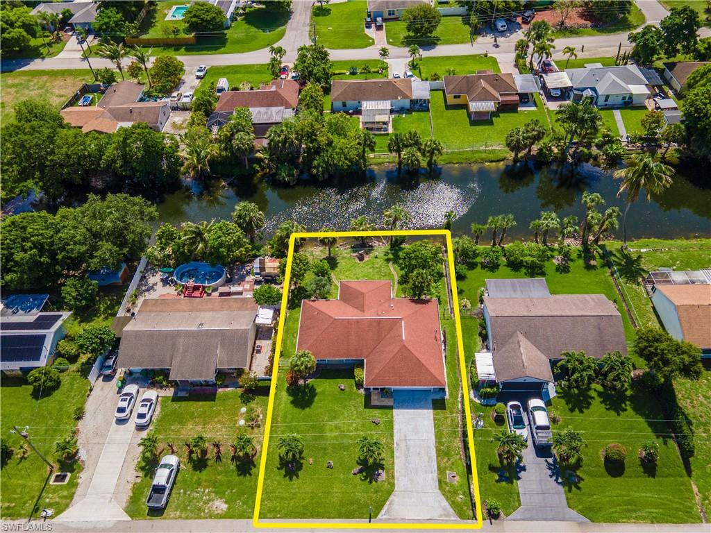 2100 55th Street Southwest Naples, FL 34116 - Photo 31 of 50 an aerial view of house with yard swimming pool and outdoor seating