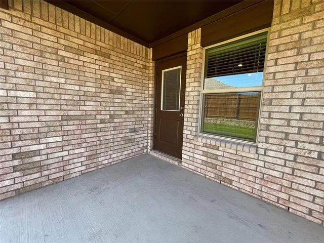 a view of a door and a window