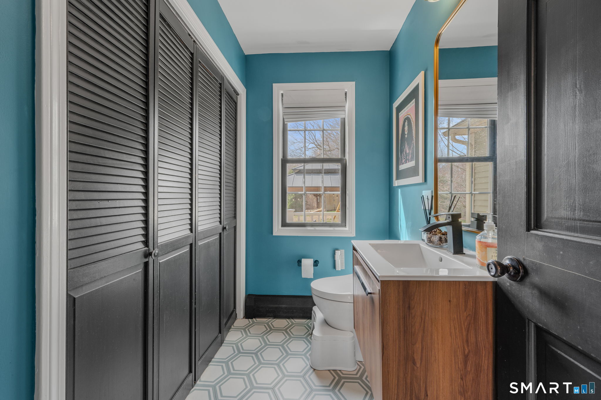 20 Coco Drive Colchester, CT 06415 - Photo 24 of 40 a bathroom with a bathtub a sink and a large mirror