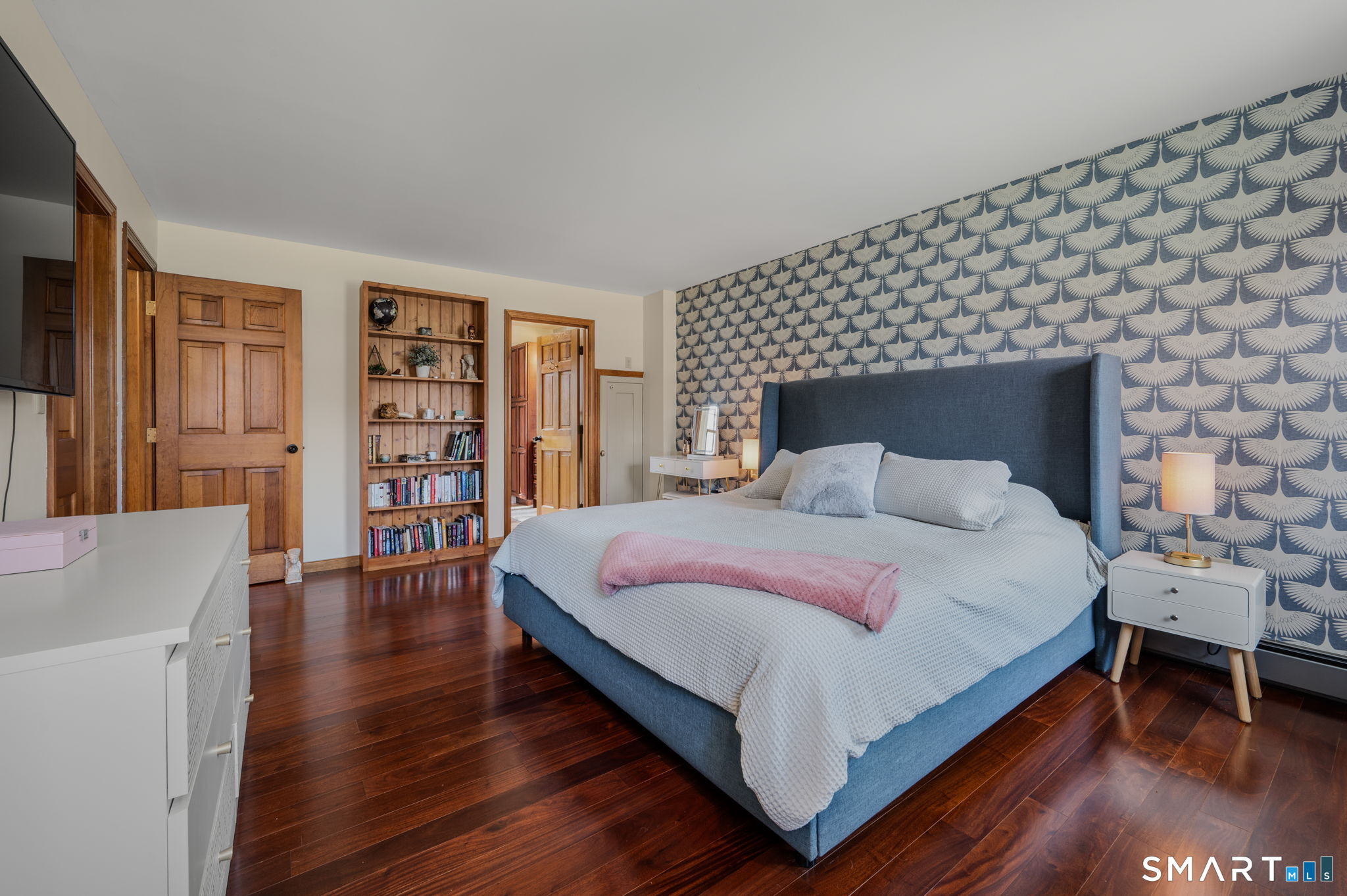 20 Coco Drive Colchester, CT 06415 - Photo 26 of 40 a large bedroom with a bed and wooden floor