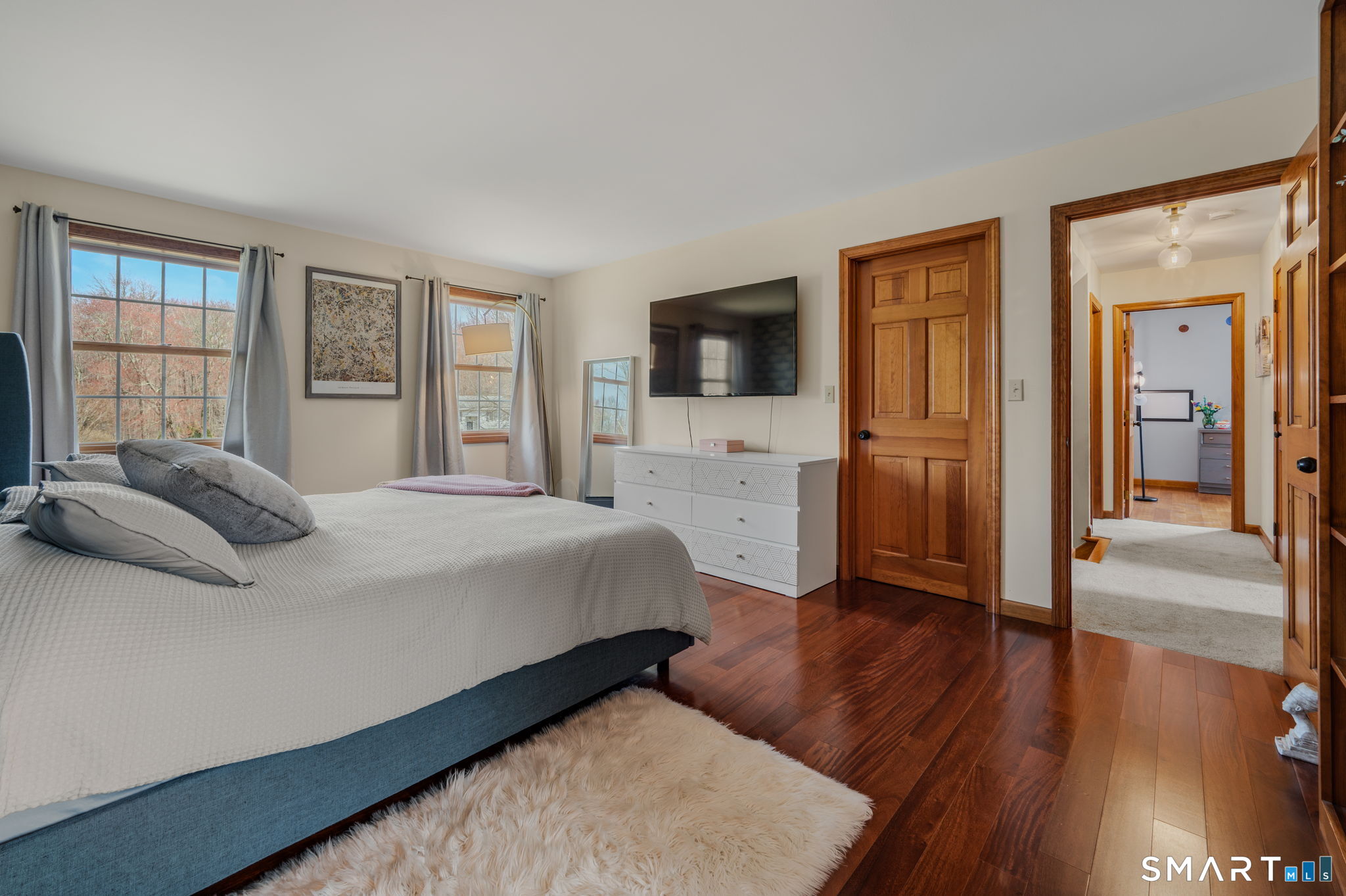 20 Coco Drive Colchester, CT 06415 - Photo 27 of 40 a bedroom with a bed and a flat screen tv